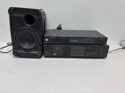 Insignia NS-SB515 wireless subwoofer / Luxman stereo cassette deck and a Kenwood audio timer.