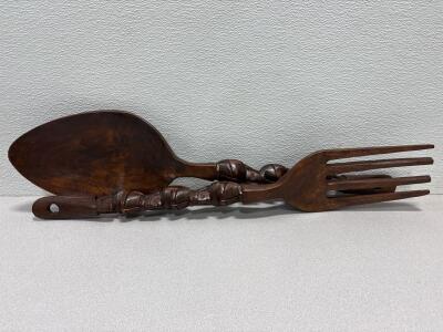 hand-carved wooden tiki-style fork and spoon wall decor