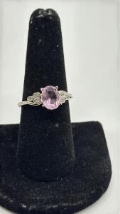 Size 9 Faceted Oval Cut Pink Kunzite Set Into A Stamped 925 Silver Ring