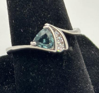 Size 10 Faceted Auqamarine Trillion Cut Set Into A Stamped 925 Silver Ring