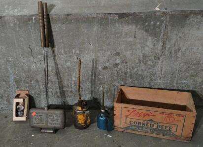 (2) Assorted Sized Vintage Oil Cansisters, (1) Vintage "Double the Original Solid Cast Iron Pie Iron", (1) Vintage "John Shockey" Idaho Hockey Player Bobble Head, & (1) Vintage "Lilly's Cooked Corned Beef" Storage Box