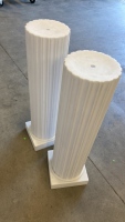 Two plastic pedestals