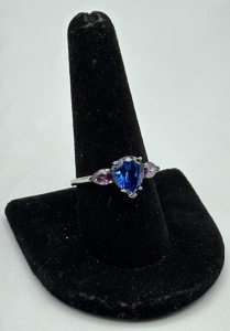 Blue Sapphire / Amethyst Set Into A Silver Toned Ring Size 10