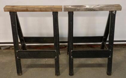 A Pair of Iron Horse Saw Horses Foldable 30" Tall.