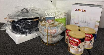 Homeware Lot (1) Mini Slow Cooker (1) Teaset With Plates and Cups (6) Cans Unopened Sugar Free Cappuccino Mix (1) Set 200 Paper Plates (1) Electric Lunchbox New In Box