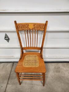 Traditional Wooden Chair with Decorative Backrest and Cane Seat