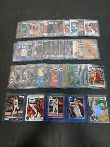 (50) Assorted Basketball Cards Including NBA Hoops, Luminance And Chronicles D'Angelo Russell, Jimmy Butler In Plastic Hard Cover