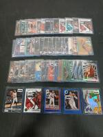 (50) Assorted Basketball Cards Including NBA Hoops, Luminance And Chronicles D'Angelo Russell, Jimmy Butler In Plastic Hard Cover