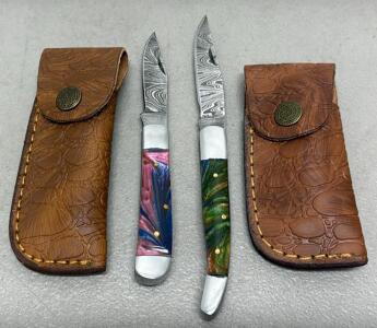 (2) Damascus Steel Folding Knives with Multicolored Resin Handles, Leather Sheaths