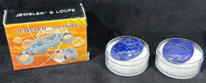 (1) 46.95ct. Lapis Lazuli Cabochon (1) 44.55ct. Lapis Lazuli Cabochon (1) Jewelers loupe