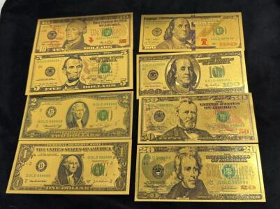 (8) Novelty Gold Toned U.S. Bills. Including: $1, $2, $5, $10, $20, $50, & $100 Bills