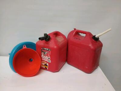 (2) 5 Gallon Plastic Gas Cans, One For Diesel, And Two Large Funnels