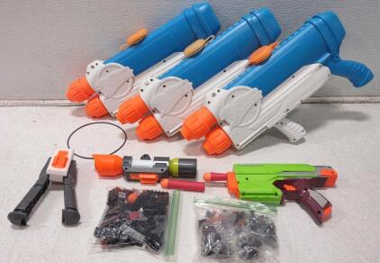 (3)Super Soakers, (2)Nerf Guns, Legos Piece(2 Bags.)