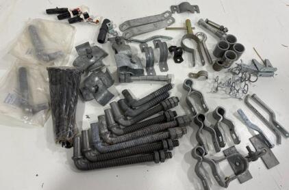 Various clamps and brackets, bolts and nuts, U-bolts, springs, plastic insulators, typically suitable for standard outdoor antennas.