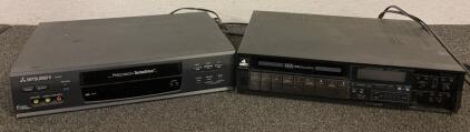 Vintage VHS Videocassette Recorder And A Mitsubishi HS-U577 4-Head Hi-Fi Stereo VCR With Precision TurboDrive Technology