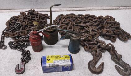 (1)Heavy Duty Tow Chain, (1) Medium Duty Tow Chain, (3) Oil Cans, & A Genuine GM Differential Pinion Gear Shaft With Part # 26056109.