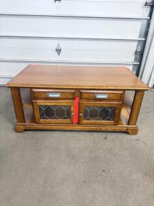 Medium Brown Coffee Table with Glass Paneled Cabinets and Shelves