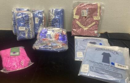 (2) Blue Pajamas ( New Small ) / New Mauve Pajamas ( Medium) / Pink ( XL ) and (5) Independence Day 10 Piece Kit.