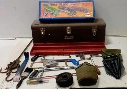 Military Trench Shovel. Giant Metal Toolbox (30"x9"x10".) 13" Pry Bar. Military Canteen (Looks/Smells Clean.) (3) Hacksaws. Antique Hanging Game/Meet Hook. Roll Of Fencing Wire.(Hot Wheels Case Is Empty. +More.