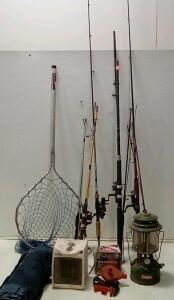 (7) Lot Of Fishing Poles (2 Ugly Sticks, Others Various.) 1 Is A Sturgeon Rod. Coleman GAS Lantern. Fast Fill Raft Inflator (Unable To Test.) Holmes Electric Heater (Turns On.) +More.