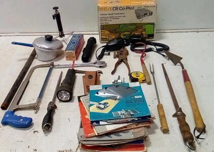 (17) Saw Blades (Check Pic.) RCA CB Copilot (Looks Like New In Box) +(2) Extra Mics. Vintage Eveready Flashlight (Looks Like New.) Knife Sheath. Hacksaw. (2) Knife Sharpeners. +More.