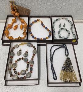 (1) Orange and Black Handmade Recycled Paper Bead Necklace and Earrings Set from Uganda (1) Necklace Featuring Blue and White Patterned Glass Beads, possibly Antique African Trade Beads Interspersed with Round Amber or Carnelian Beads and Gold-toned Spac