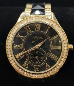 (1) Anne Klein 12/2142BKGB Two-Tone Gold And Black Ceramic Watch