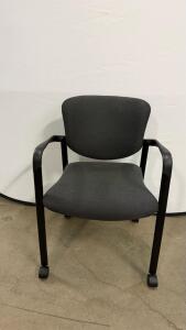 Black Office Chair with Armrests and Rolling Legs