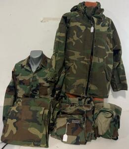 Military Clothing Including Coat, 2 Tops, & 5 Pairs Of Pants