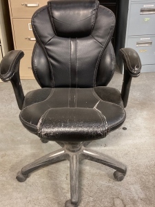 Worn Black Computer Chair