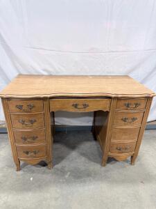 Light Brown Wooden Vanity with 7 Drawers and Ornate Metal Handles