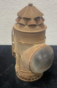 This is an antique Dietz Police or "Bullseye" lantern, also known as a "dark" lantern. These were used by police officers and others in the mid-1800s and early 1900s before battery-operated flashlights became common.