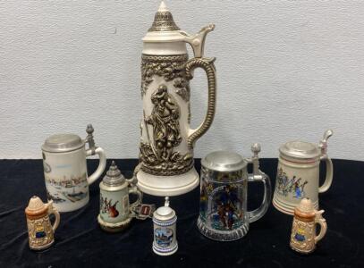 (8) Porcelain and Glass Steins - Ranging in Sizes - 4&rdquo; to 18&rdquo;