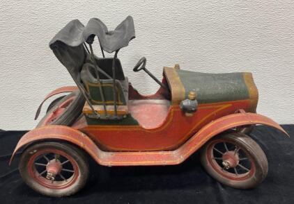 This is a large-scale, handmade vintage model of a Ford Model T Torpedo Roadster. It is a collectible item crafted from materials such as metal and wood, featuring a canvas top 21x13