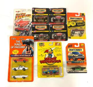 A Collection Of Vintage Die-Cast Metal Toy Vehicles From The 1990s, Including A Set Of Matchbox "Madness" Series Cars Exclusive To Taco Bell, A Maisto "Turbo Tread," An Ertl "Dukes Of Hazzard" 3-Vehicle Action Chase Set, And A Revell "Woody Woodpecker" Ca