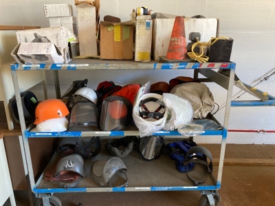 Rolling cart of Assorted Face shields and helmets