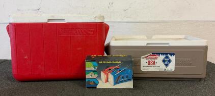 (1) 48 Coleman Quart Cooler, (1) Coleman Party Stacker Cooler, And AM/FM Radio Flashlight