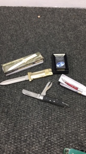 (1) Windy Zippo Lighter In Box (2) Pocket Knives (1) Reproduction German Paratrooper knife