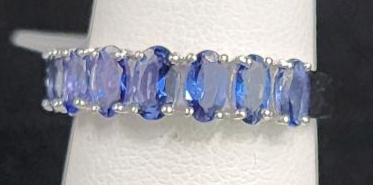 (1) Size 6 1/2 .925 Oscar Friedman Seven Tanzanite Stone Ring