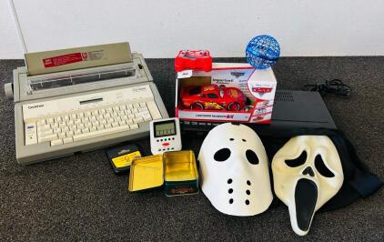Brother GX-8000 Typewriter, RCA Blu-ray Player, Disney RC Car, Horror Masks, Games, Tin Lot (All Electronics Tested and Work)