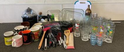 Multiple Sets Of Glasses, Mugs, Glass Pyrex Dishes, Various Utensils, Silverware, Measuring Cups And Spoons, Cake Pan, Hamilton Beach 1.5-Quart Ice Cream Maker, Cutting Board, Blueray Player And More