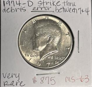 1974-D MS63 VERY RARE Strike Thru Debris Error Between (7-4)