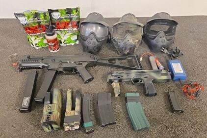 (2) Airsoft Guns w/ Magazines, (6) Extra Various Airsoft Magazines, Batteries w/ Charger, (3) Safety Masks, Airsoft BBs