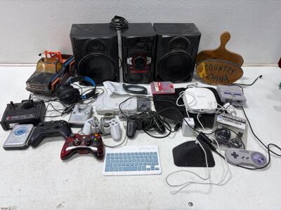 Mixed Electronics Lot: PS One, SNES, RCA Stereo, Eero Router, Xbox Controllers, Cassette Player. Unable to test.