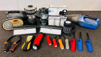 Mixed Lot Shark Cordless Vacuums, Coleman Lantern, Baxia Lights, Flashlights, Radio, VR Headset. (Most Flashlights Require Batteries, Radio Tested and Works, Vacuums Power Up But May Need Charging To Function)