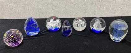 Set of 7 Art Glass Decorative Paperweights &ndash; Mixed Designs, Blue & Clear, 2.5&ndash;4 in diameter/height, hand-blown or molded glass, floral, aquatic, and animal motifs, visually good condition, quantity: 7 pieces, various internal motifs, modern/contemporary d
