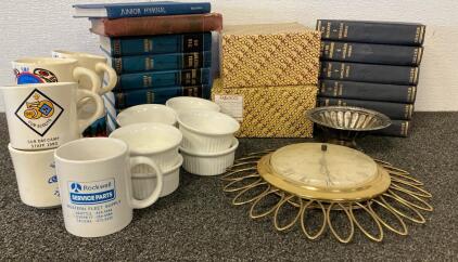 Vintage Brass Sunburst Wall Clock Featuring A Roman Numeral Face, Mugs, Books, Small Ribbed Dishes And More