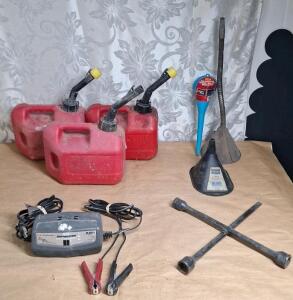 (1) Schumacher Battery Charger, (3) 1-Gallon Gas Cans W/ Spouts, (3) Funnels & (1) 3-Way Lug Nut Wrench