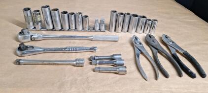 (2) 3/8" Drive Ratchets, (4) Extensions, Assorted Sockets & (3) Pairs Of Pliers