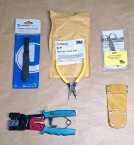 (1) Ideal Ratchet Telemaster Crimping Tool, (1) Cable Splicing Knife, (1) E-9Y Stepped Jaws Tool, (1) Pair Of Electrican Scissors & (1) Leather Tool Sheath